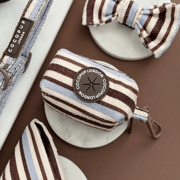 Brown, blue and white striped Poop Bag Holder. Designed to hold two rolls of poop bags. 