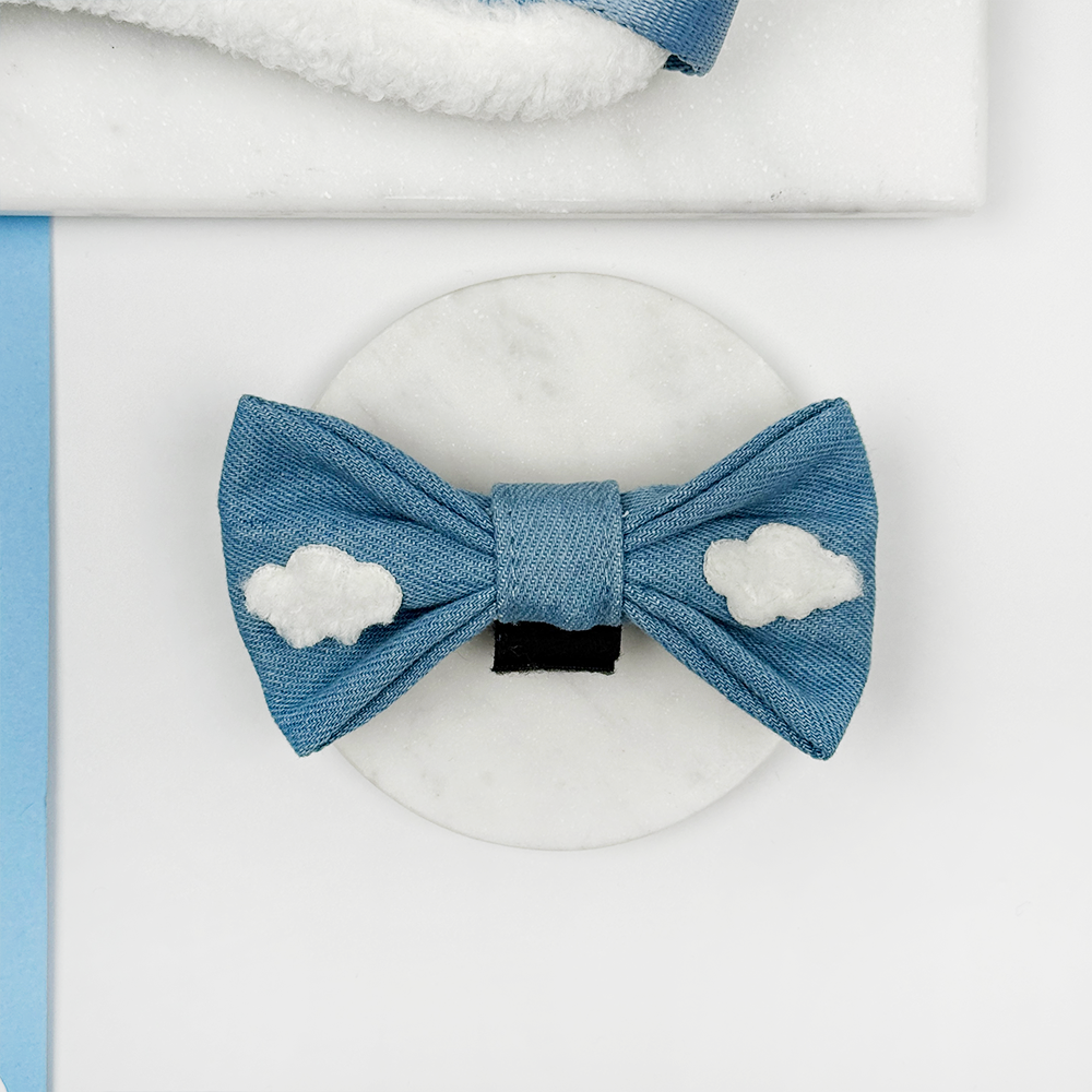 Blue denim dog bow tie with a Cocopup label on a white background
