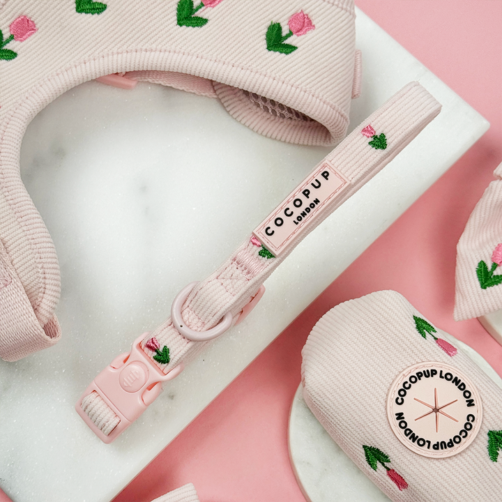 Pink dog collar with tulip embroidery and Cocopup logo.